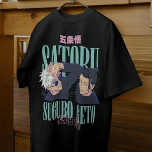 Black oversized t-shirt with anime characters and Japanese text graphic design on front.